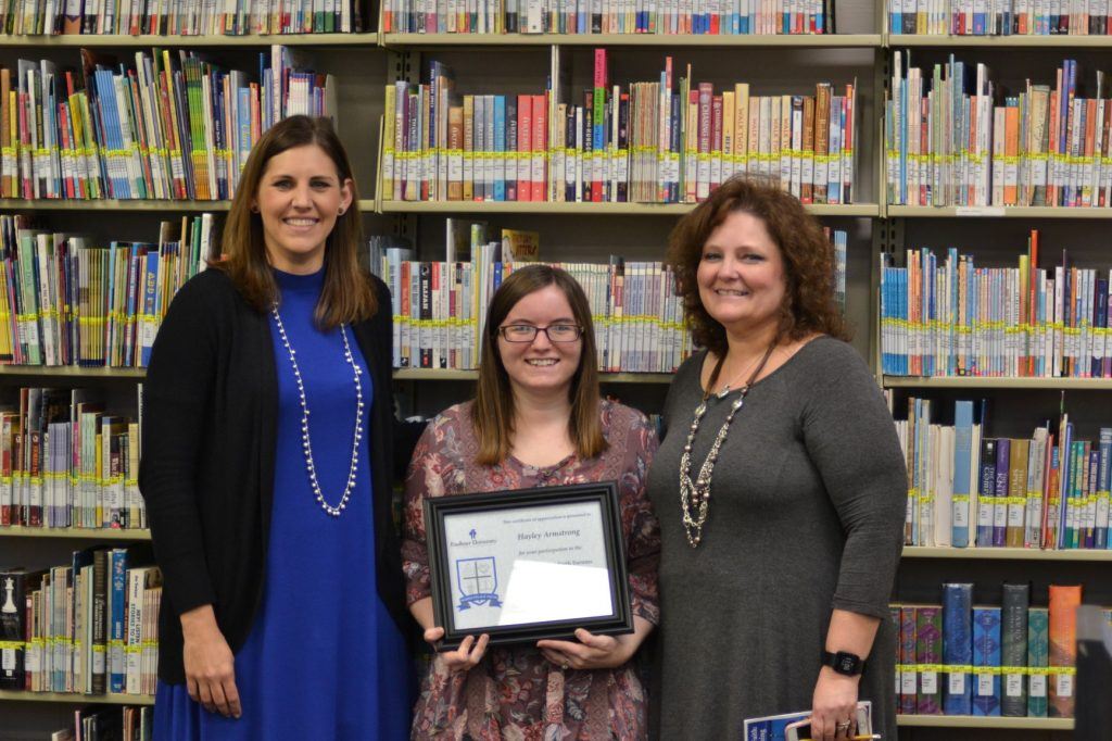 Haley Armstrong, center is honored at Marketplace Faith Friday Forums.
