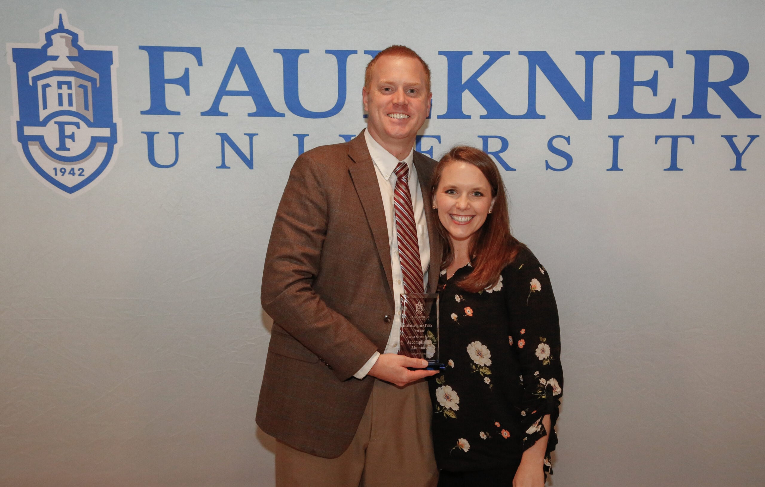 Aaron Greenwood and wife Lindsey pose together after Faulkner's Marketplace Faith Friday Forums. 