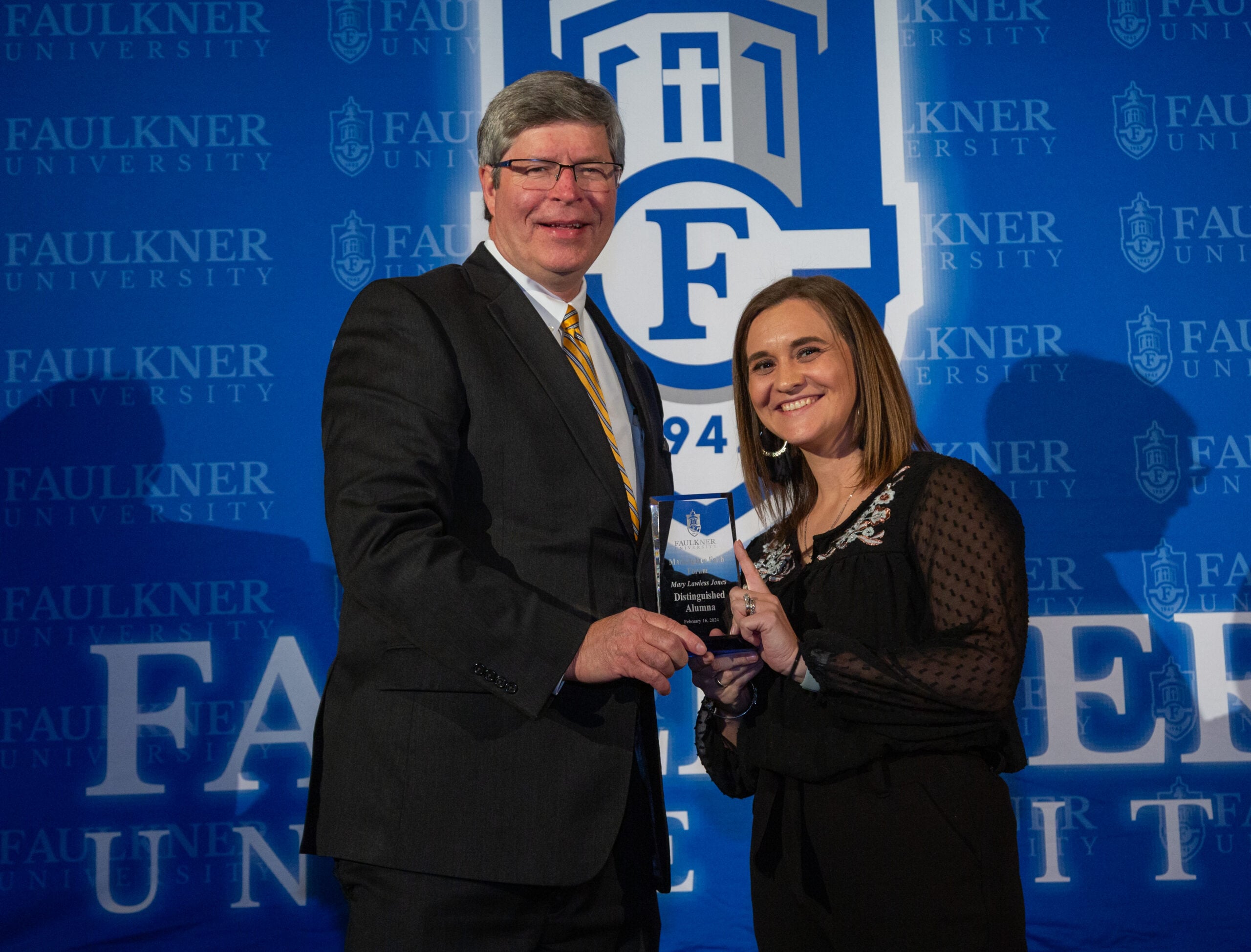 l-r President Mitch Henry  presents Mary Lawless Jones with the Distinguished Alumna Award. 