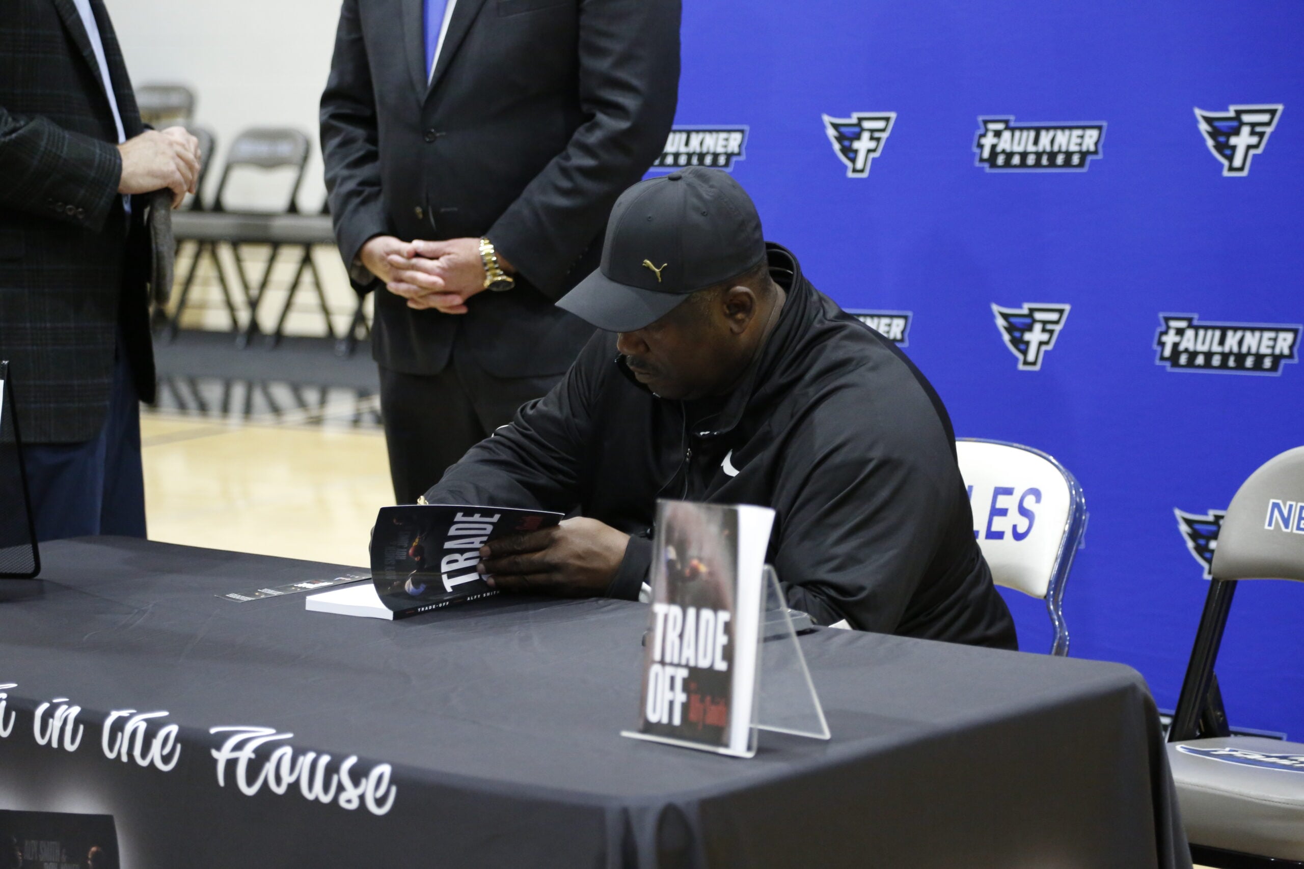 Alfy Smith inscribes one of his books. 