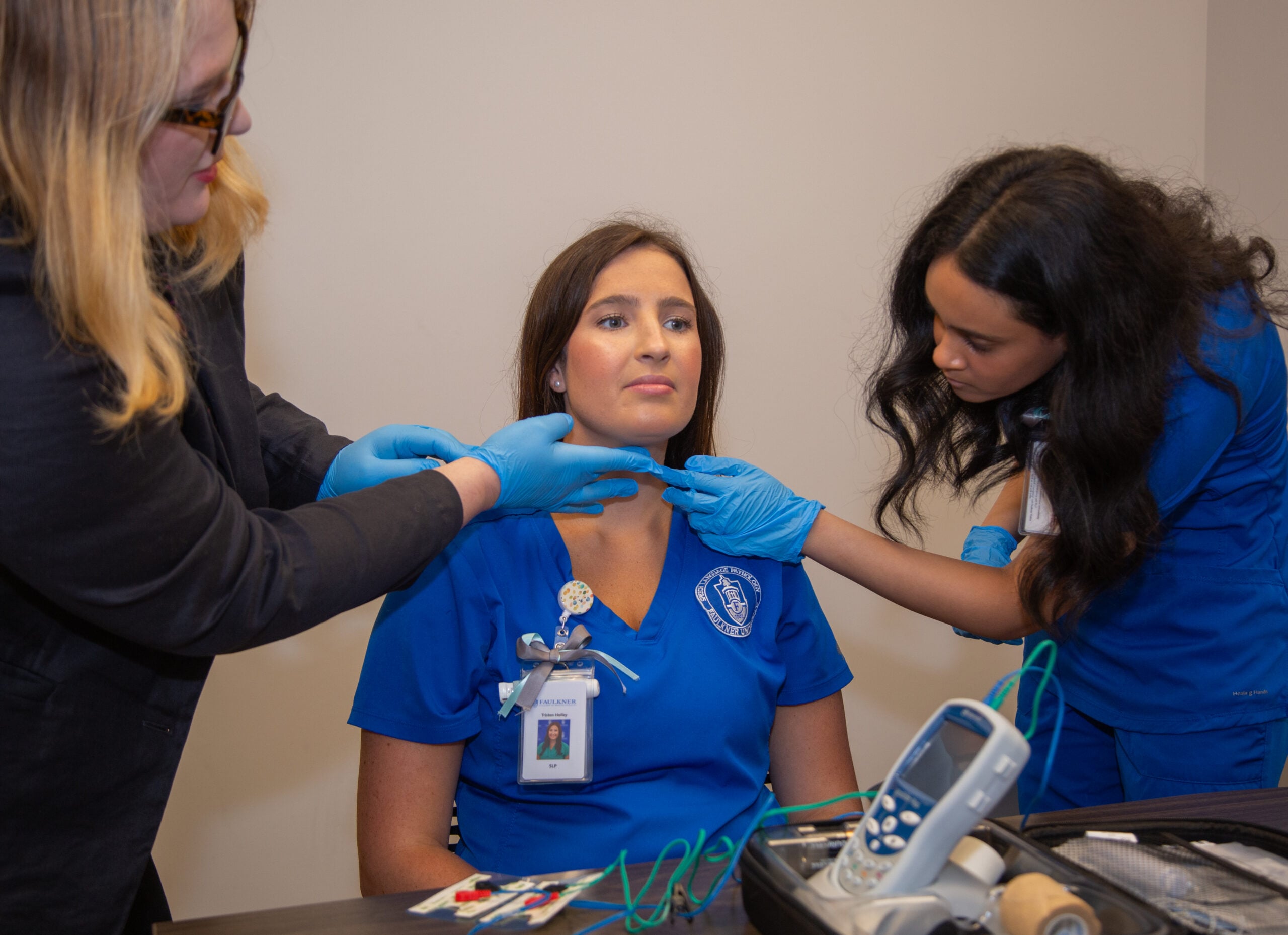 SLP students practising therapy on student